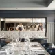 Chefs in the open kitchen of the dining room at Oxbow, Hotel Arts Kensington, Calgary, AB