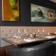 Leather chair and tables. Dining room at Oxbow, Hotel Arts Kensington, Calgary, AB