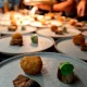 Plates of food ready for group dining, Oxbow at Hotel Arts Kensington, Calgary, AB