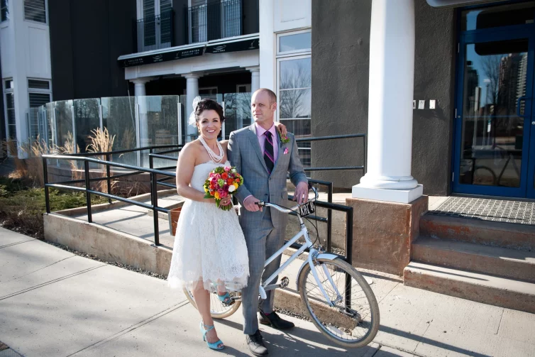 Newlyweds in front of Hotel Arts Kensington, Calgary, AB