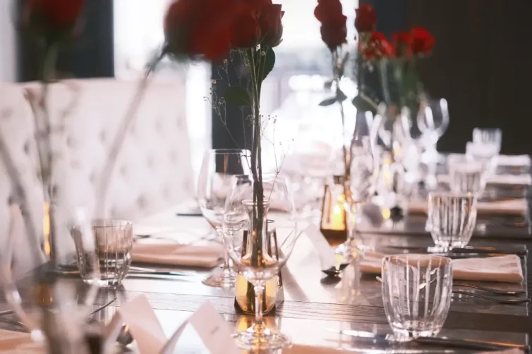 Table setting for wedding with roses at Oxbow, Hotel Arts Kensington, Calgary, AB