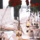 Table setting for wedding with roses at Oxbow, Hotel Arts Kensington, Calgary, AB